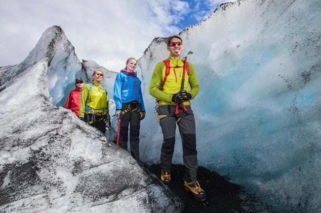 A group of people walking through a crevasse on Sólheimajökull glacier